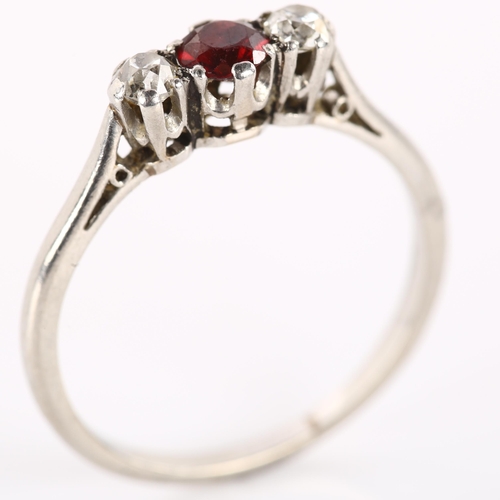 1172 - A three stone ruby and diamond ring, unmarked white gold settings test as 18ct, total diamond conten... 