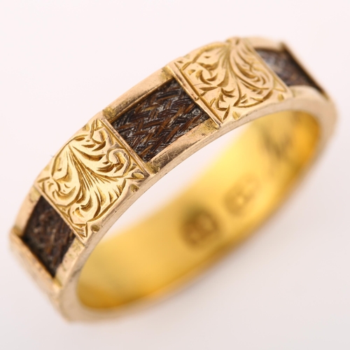 1174 - A Victorian 15ct gold mourning band ring, with alternating woven hair and engraved foliate panels wi... 