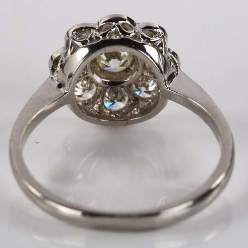 1177 - A platinum diamond cluster flowerhead ring, set with modern round brilliant-cut diamonds, total diam... 