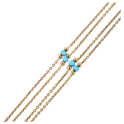 1178 - An Antique cable link long guard chain necklace, unmarked gold settings test as 9ct with blue bead s... 