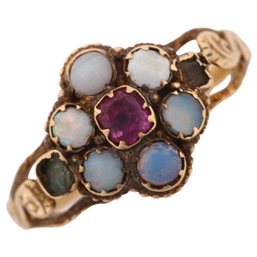 1180 - A Victorian ruby opal and paste cluster flowerhead memorial ring, with concave glass covered panel r... 