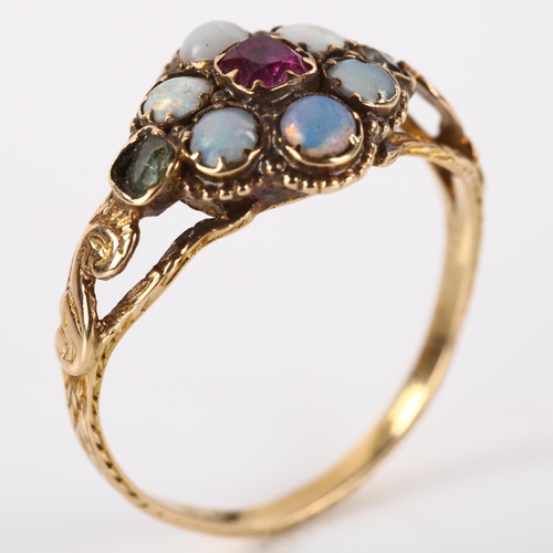 1180 - A Victorian ruby opal and paste cluster flowerhead memorial ring, with concave glass covered panel r... 