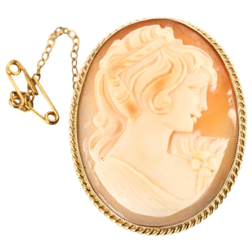 1184 - A Vintage shell cameo brooch, depicting female profile in 9ct frame, brooch height 37.9mm, 8.9g