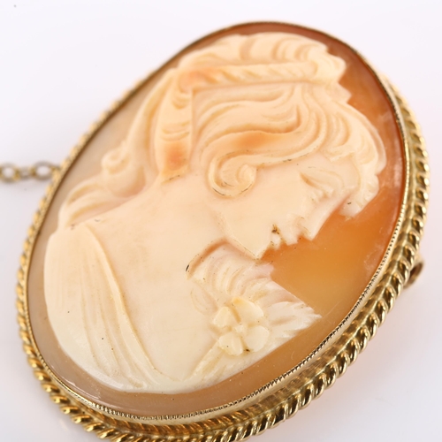 1184 - A Vintage shell cameo brooch, depicting female profile in 9ct frame, brooch height 37.9mm, 8.9g