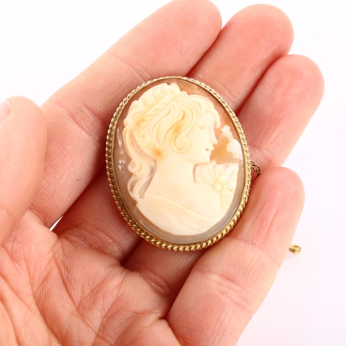 1184 - A Vintage shell cameo brooch, depicting female profile in 9ct frame, brooch height 37.9mm, 8.9g