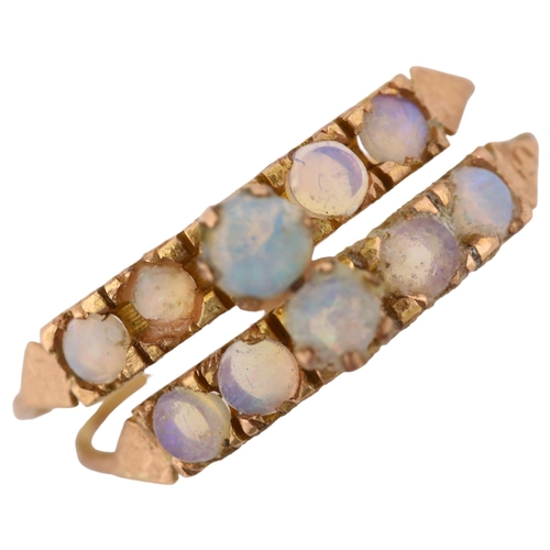 1186 - A Middle Eastern 14ct rose gold opal harem double-band ring, set with round cabochon opal, overall s... 