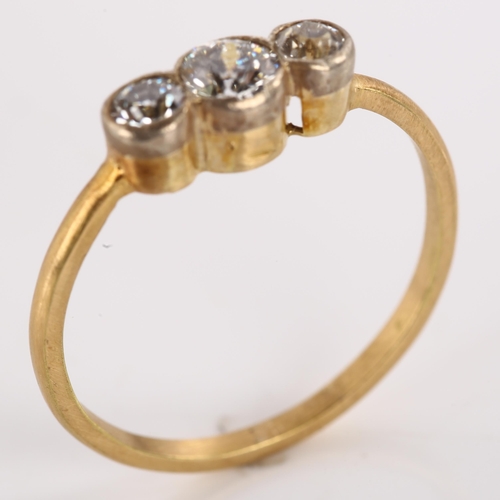 1190 - A three stone diamond ring, unmarked gold settings with old European-cut diamonds, total diamond con... 