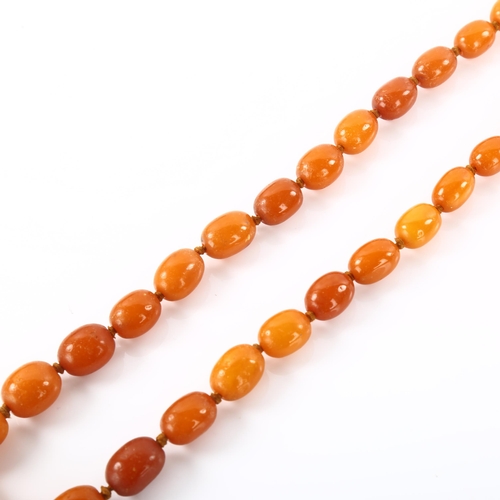 1194 - A single-strand graduated butterscotch amber bead necklace, bead sizes 19.8 - 11.9mm, necklace lengt... 