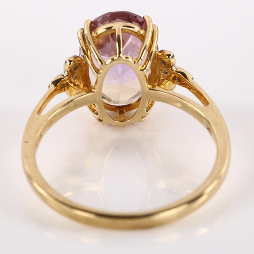 1202 - A modern 9ct gold ametrine and diamond dress ring, set with oval mixed-cut ametrine and single-cut d... 