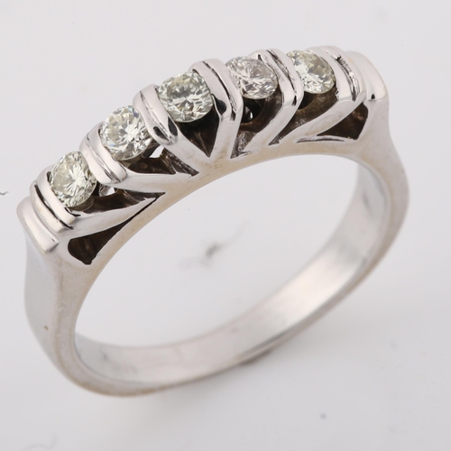 1203 - A five stone diamond ring, unmarked white gold settings with modern round brilliant-cut diamonds, to... 