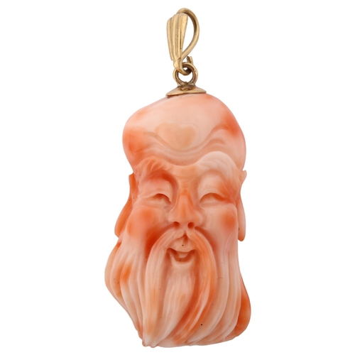 1204 - A Chinese coral Shoulau God head pendant, unmarked gold mount, pendant height 45.5mm, 9.6g