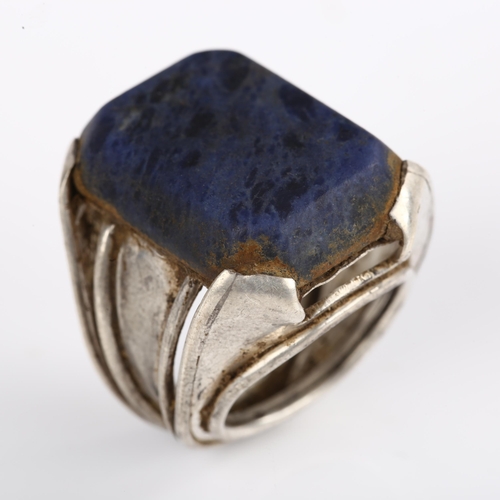 1374 - A large Indian silver sodalite dress ring, setting height 26.7mm, size approx G, 14.7g