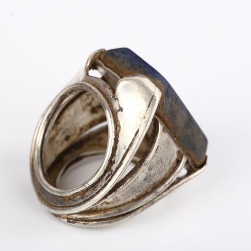 1374 - A large Indian silver sodalite dress ring, setting height 26.7mm, size approx G, 14.7g