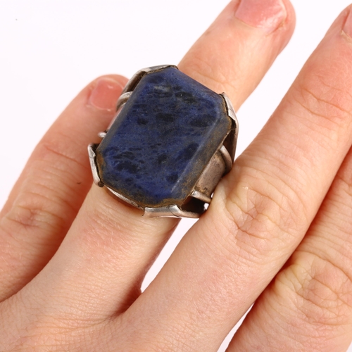 1374 - A large Indian silver sodalite dress ring, setting height 26.7mm, size approx G, 14.7g