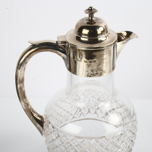 1515 - A Victorian silver-mounted glass Claret jug, by William Henry Leather, hallmarks Birmingham 1899, he... 