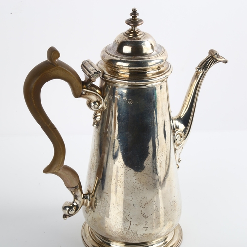 1517 - A George II silver coffee pot, tapered cylindrical form with turned wood handle and scrolled acanthu... 