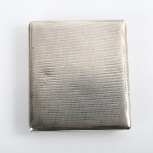 1524 - An Art Deco George V silver pictorial cigarette case, rectangular form with allover engine turned de... 