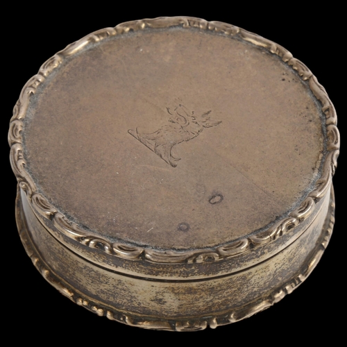 1526 - An Edwardian circular silver box, with raised foliate border and gilt interior, by Deakin & Francis ... 