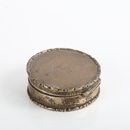 1526 - An Edwardian circular silver box, with raised foliate border and gilt interior, by Deakin & Francis ... 