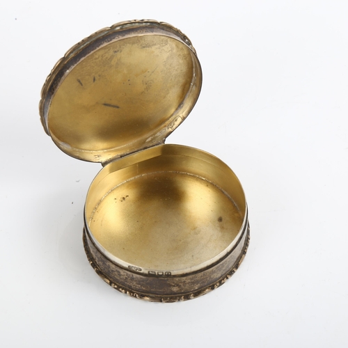 1526 - An Edwardian circular silver box, with raised foliate border and gilt interior, by Deakin & Francis ... 