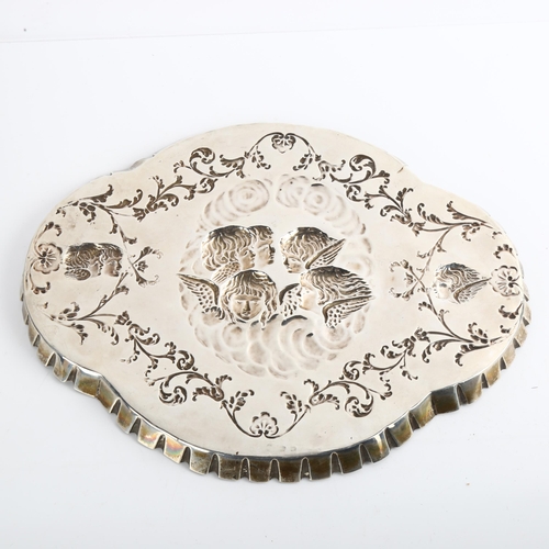 1541 - An Edwardian silver dressing table tray, oval lobed form with crimped rim and relief embossed cherub... 