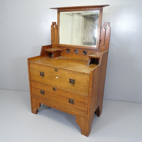 2509 - An Arts and Crafts oak dressing chest with raised mirror mirror back, two long drawers and pierced d... 