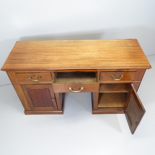 2510 - An antique mahogany kneehole writing desk with three drawers and cupboards under. Overall 136x79x49c... 