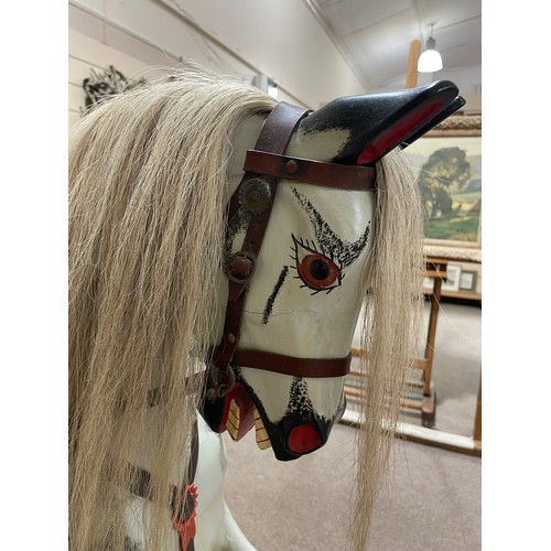 57 - An early 20th Century dappled grey Rocking Horse in the manner of F.H.Ayres, London, with studded le... 