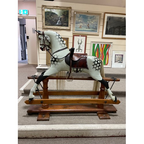 57 - An early 20th Century dappled grey Rocking Horse in the manner of F.H.Ayres, London, with studded le... 