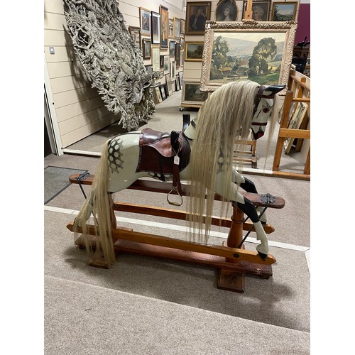 57 - An early 20th Century dappled grey Rocking Horse in the manner of F.H.Ayres, London, with studded le... 