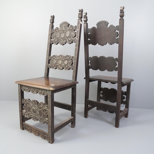 2002 - A pair of carved oak renaissance style hall chairs.