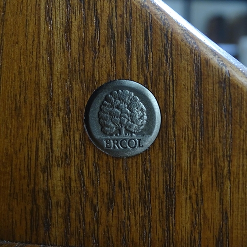 2004 - An Ercol mid-century elm waterfall open bookcase, with maker's label. 89x128x33cm.