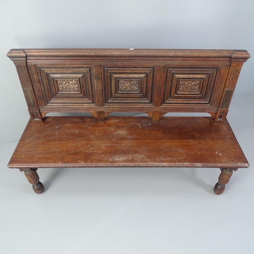 2008 - An antique carved and panelled oak hall seat. 145x91x50cm