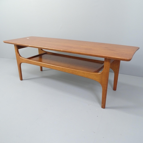 2010 - A mid-century teak two-tier coffee table. 117x41x41cm