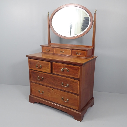 2014 - An Edwardian crossbanded mahogany and satinwood strung dressing chest, with fitted oval mirror. 90x1... 