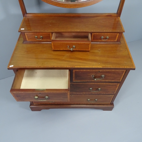 2014 - An Edwardian crossbanded mahogany and satinwood strung dressing chest, with fitted oval mirror. 90x1... 