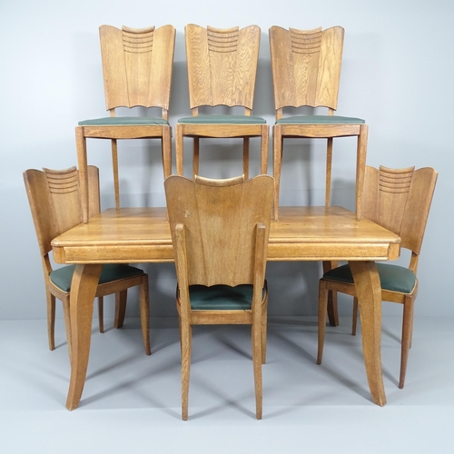 2015 - A 1930s French oak dining table, 138x74x90cm, and six matching chairs.