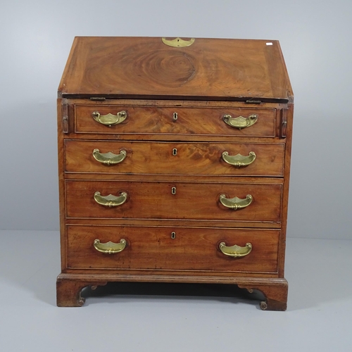 2021 - A Georgian mahogany Bureau, the fall front revealing a fitted interior, with four long drawers below... 