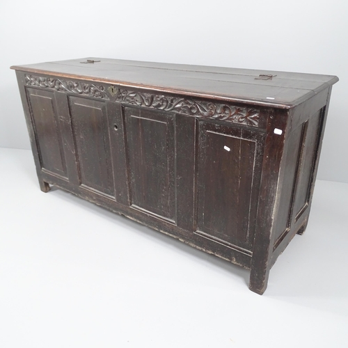 2023 - A 19th century panelled oak coffer, with chip carved decoration and raised on stile legs. 168x84x61c... 