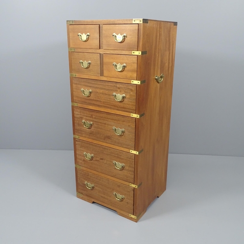 2026 - A teak and brass-bound campaign style chest of four short and four long drawers,. 46x108x41cm.