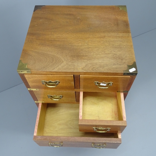 2026 - A teak and brass-bound campaign style chest of four short and four long drawers,. 46x108x41cm.