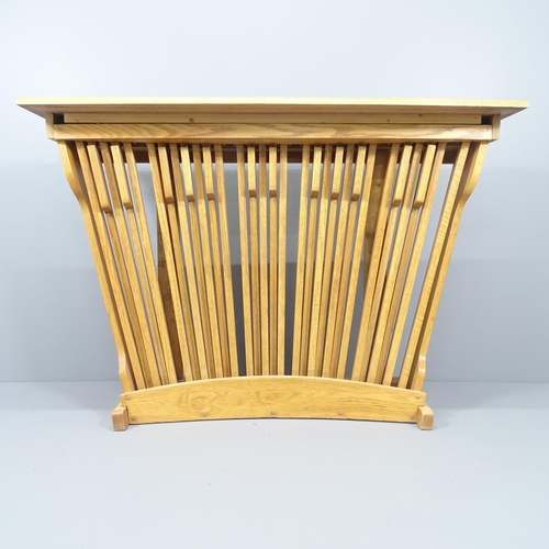 2033 - A contemporary design oak console table with organ pedal front. 137x96x35cm