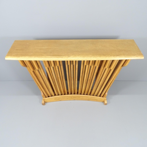 2033 - A contemporary design oak console table with organ pedal front. 137x96x35cm