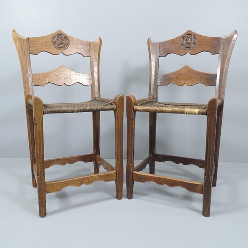 2034 - A pair of European or Russian Arts & Crafts chairs with chip carved top rails in the manner of Polen... 