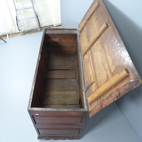 2037 - An antique panelled oak mule chest, with brass mounts. 152x88x60cm