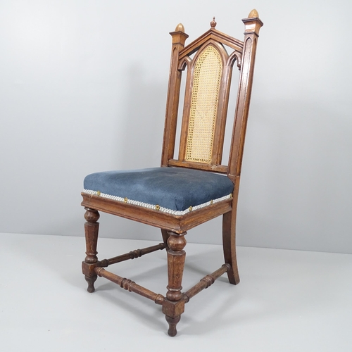 2041 - WITHDRAWN - An antique Gothic oak and upholstered Pugin style chair, with cane panelled back. Origin... 