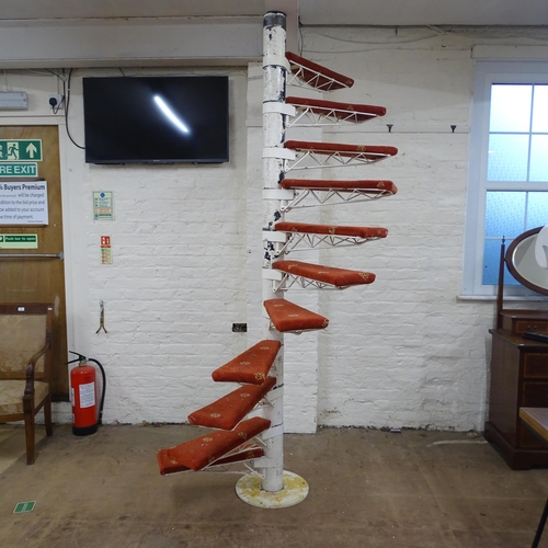 2050 - A cast iron spiral staircase, with eleven adjustable steps. Height 247, tread width 56cm, tread dept... 