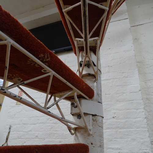 2050 - A cast iron spiral staircase, with eleven adjustable steps. Height 247, tread width 56cm, tread dept... 