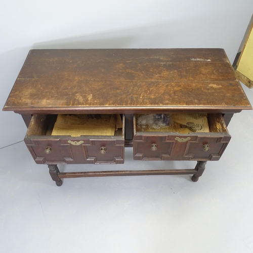 2517 - A 1920s oak sideboard with two fitted drawers and applied carved decoration. 130x92x56cm.