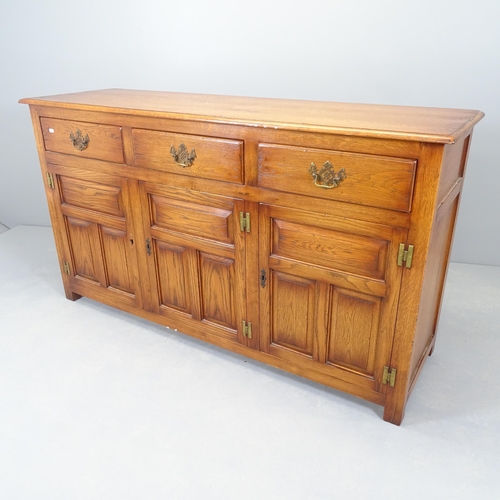 2519 - A reproduction oak sideboard by Bevan Funnell, with three frieze drawers, cupboards under and maker'... 